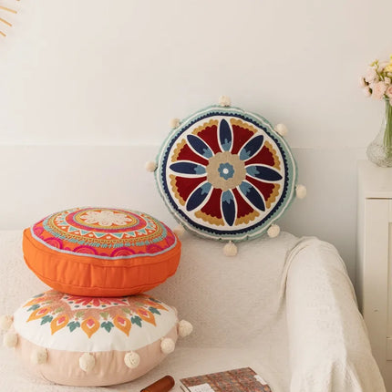 Coussin rond orange brodé épais