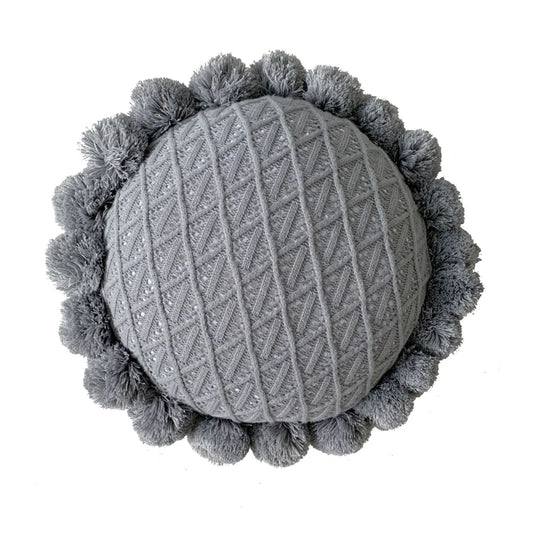 Coussin brodé rond à pompon gris