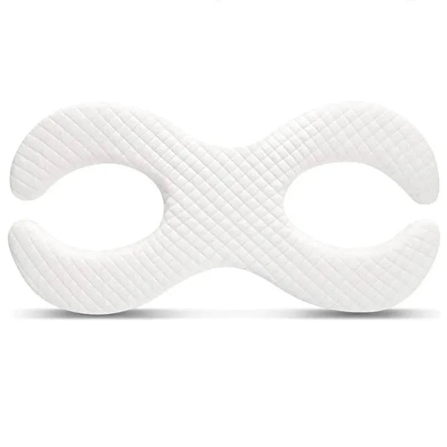 Coussin cervical de lit en mousse sur fond blanc