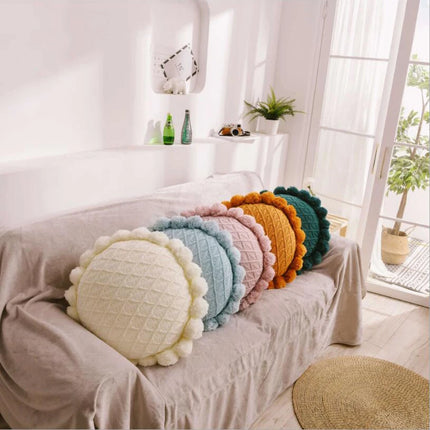 Coussin brodé rond à pompon pour salon