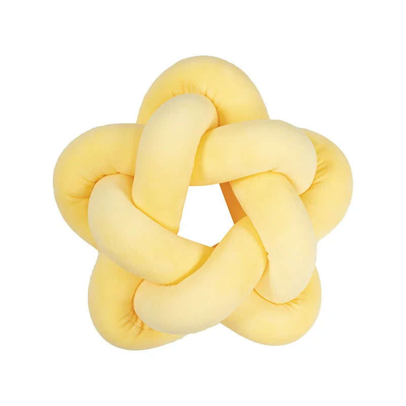 Coussin nœud en forme d'étoile jaune