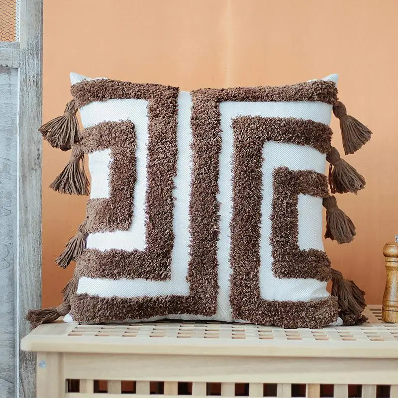 Coussin bohème avec motif carré et pompons marron