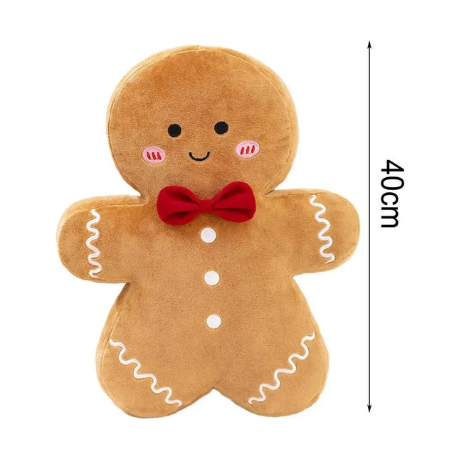 Coussin bonhomme en pain d'épices avec nœud papillon rouge